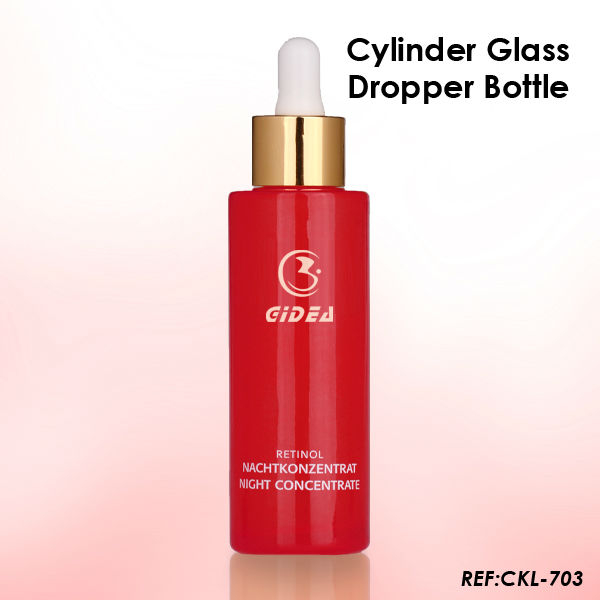 rote Farbflasche mit goldener Kappe